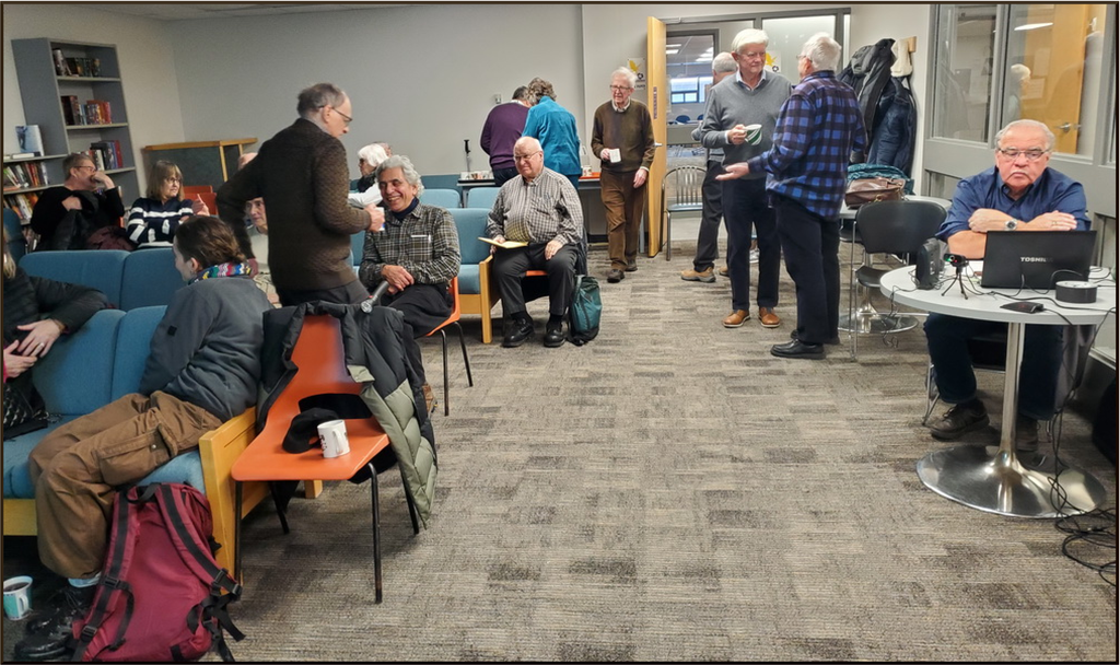 WLURA members gathering for coffee and cookies before a recent
Friday afternoon presentation.
